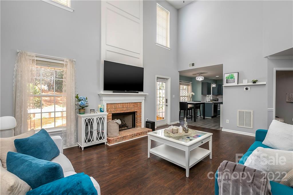 7601 Silverton Way Huntersville, NC 28078 - Photo 10 of 26 a living room with furniture flat screen tv and a fireplace