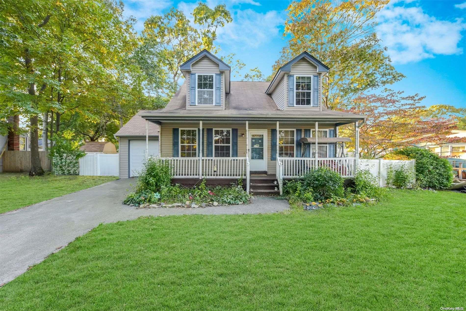 a view of a house with a yard and plants