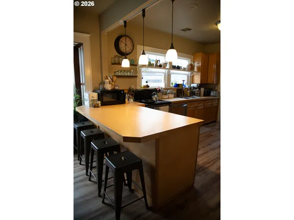 a kitchen with a table and chairs in it