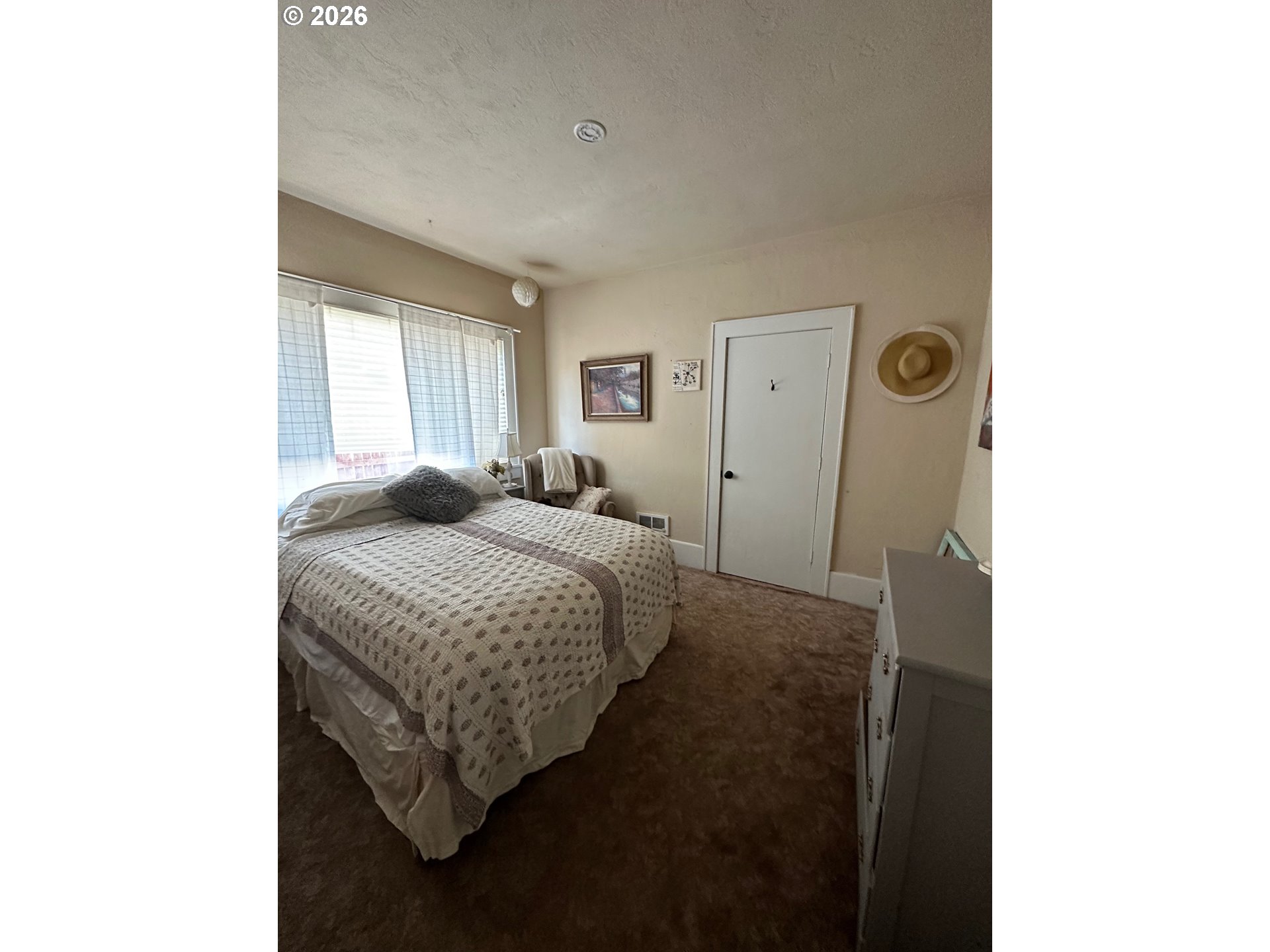 645 Juniper Street Junction City, OR 97448 - Photo 12 of 20 a bedroom with a bed and a window