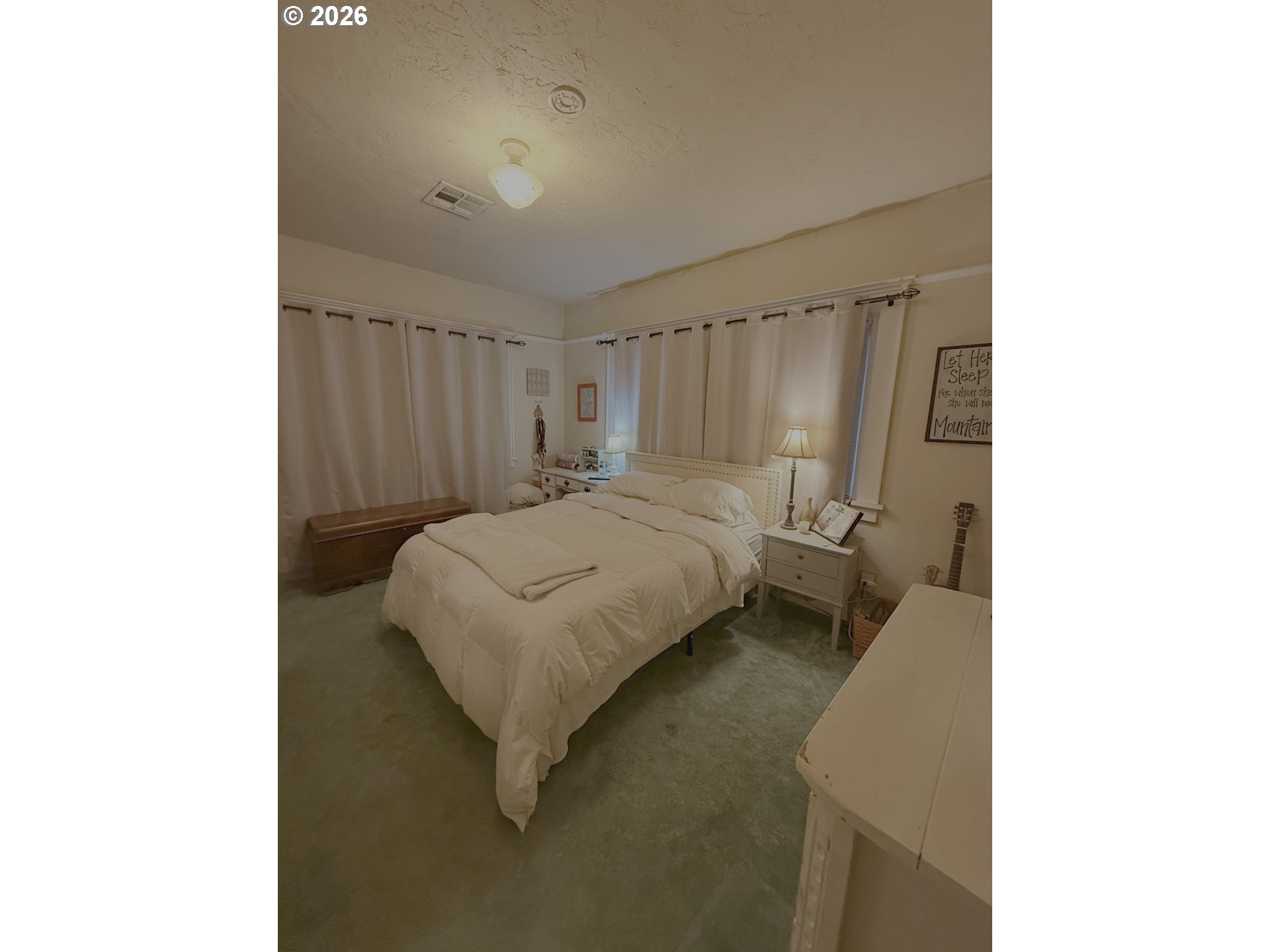 645 Juniper Street Junction City, OR 97448 - Photo 13 of 20 a bedroom with a bed and a window