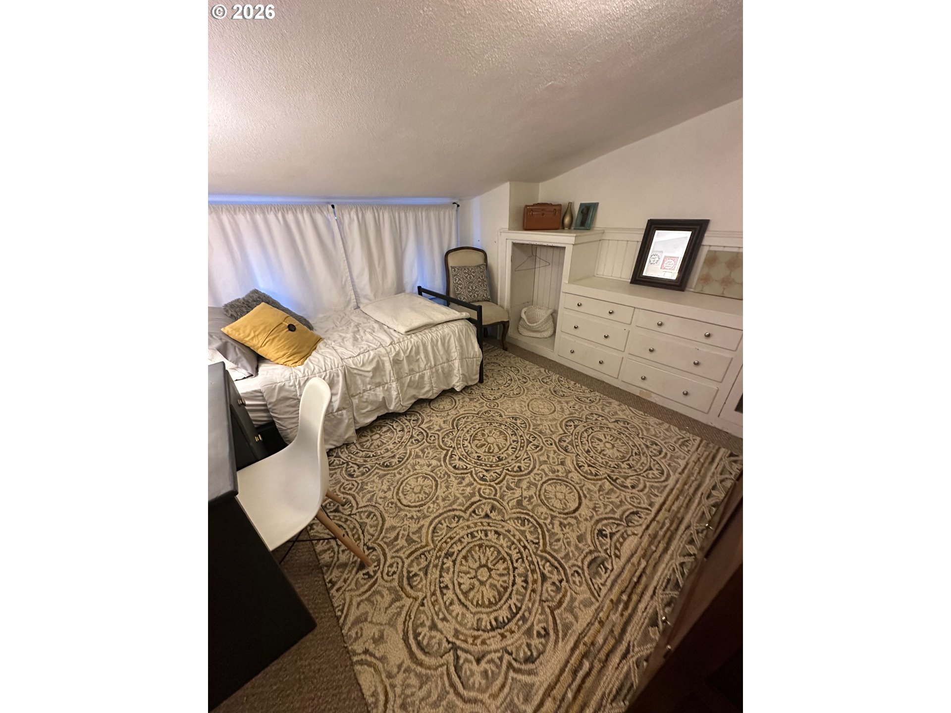 645 Juniper Street Junction City, OR 97448 - Photo 19 of 20 a bed room with a bed and a couch