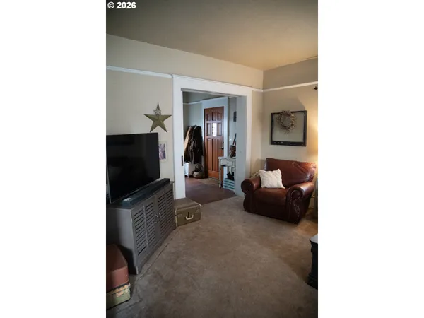 a living room with furniture and a tv