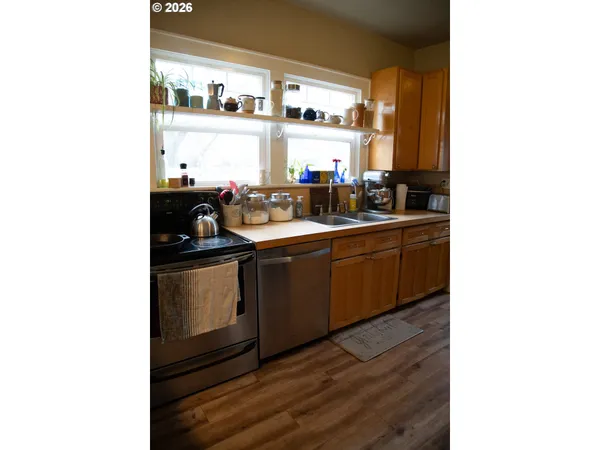 a kitchen with sink and cabinets