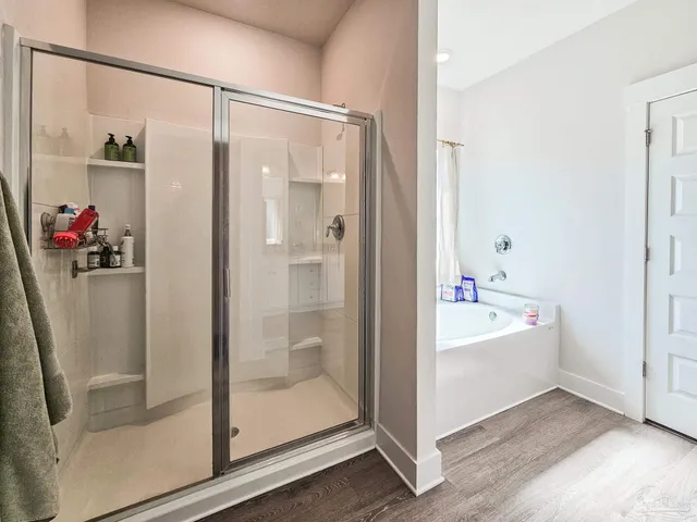 a bathroom with a bathtub and a shower