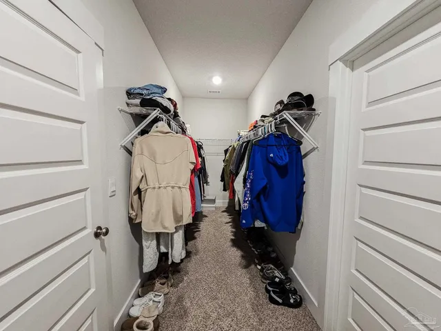 a room with gym equipment and a mirror