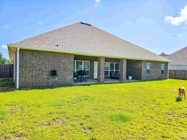 a view of swimming pool with outdoor seating