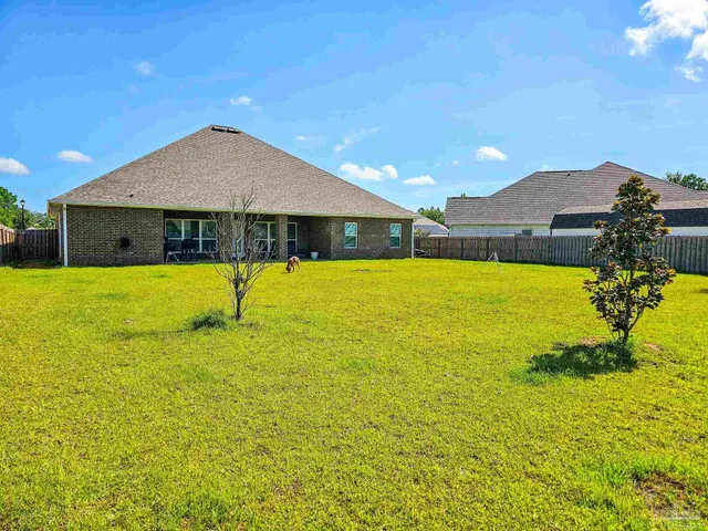 a view of a swimming pool with an outdoor space and seating area