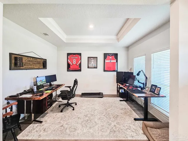 a view of a workspace with furniture