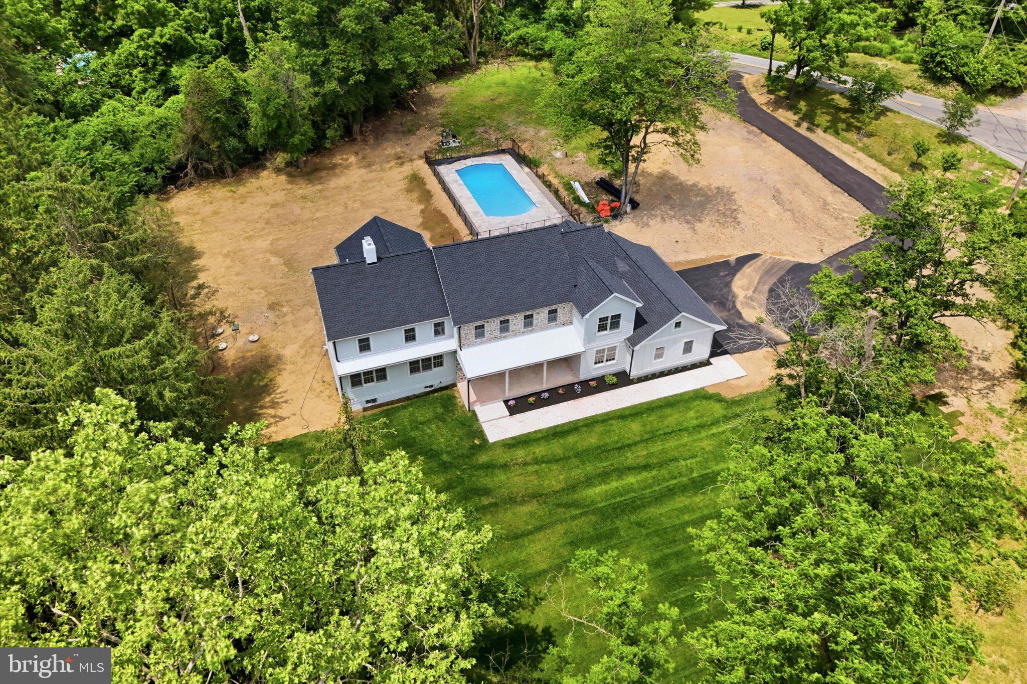 1756 Yellow Springs Road Malvern, PA 19355 - Photo 35 of 43 Serene retreat with pool and greenery.