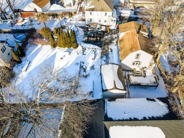 an aerial view of residential houses with outdoor space