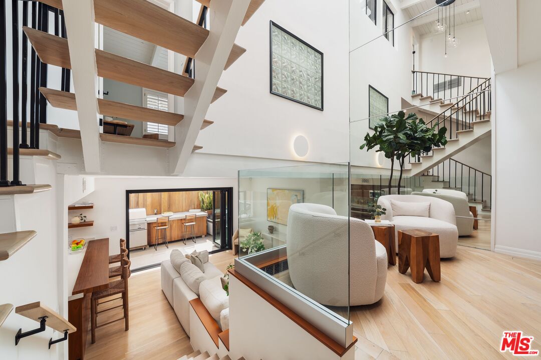 831 14th Street, Unit 2 Santa Monica, CA 90403 - Photo 1 of 32 a living room with furniture and a flat screen tv