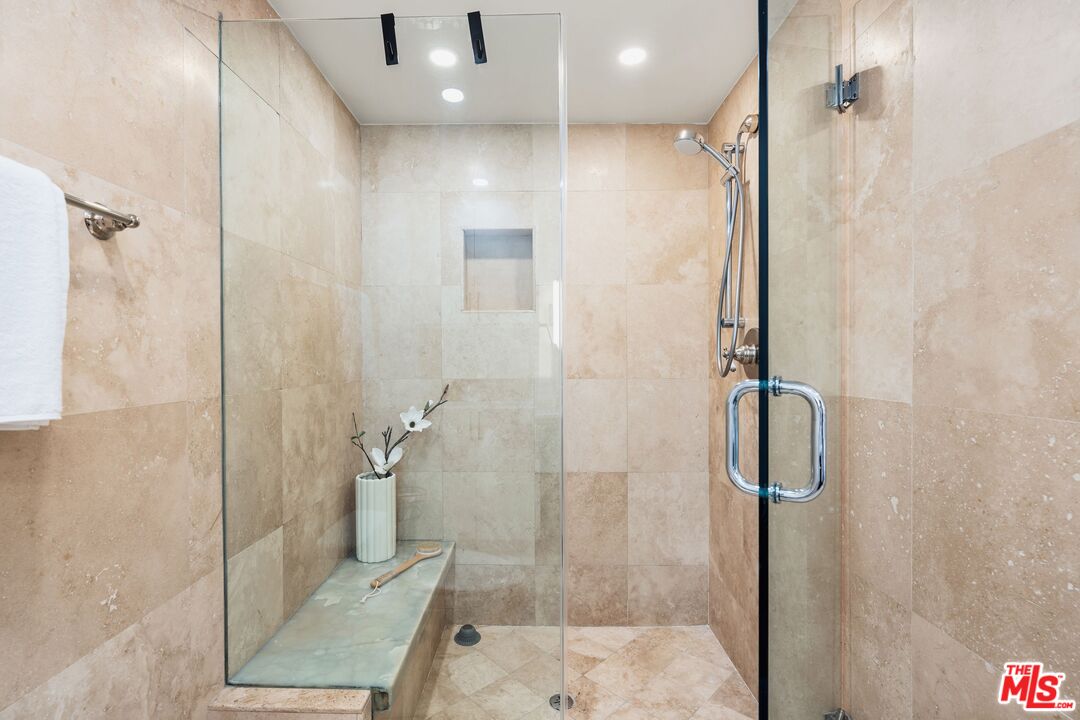 831 14th Street, Unit 2 Santa Monica, CA 90403 - Photo 19 of 32 a bathroom with a shower and a glass door