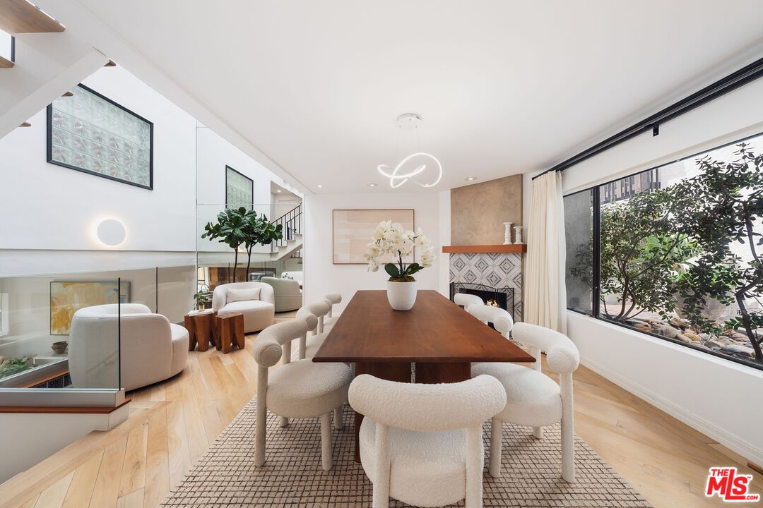 831 14th Street, Unit 2 Santa Monica, CA 90403 - Photo 3 of 32 a living room with furniture a large window and wooden floor