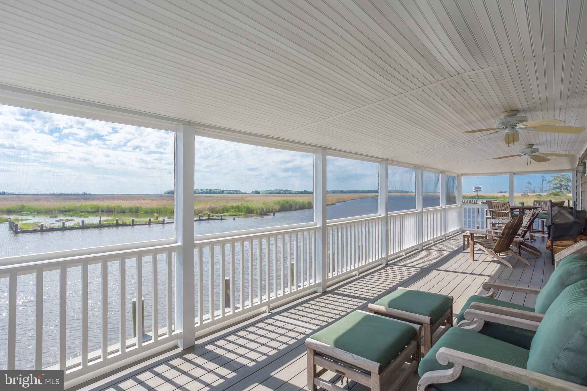 3706 Bestpitch Ferry Road Cambridge, MD 21613 - Photo 13 of 43 a view of a patio with wooden floor