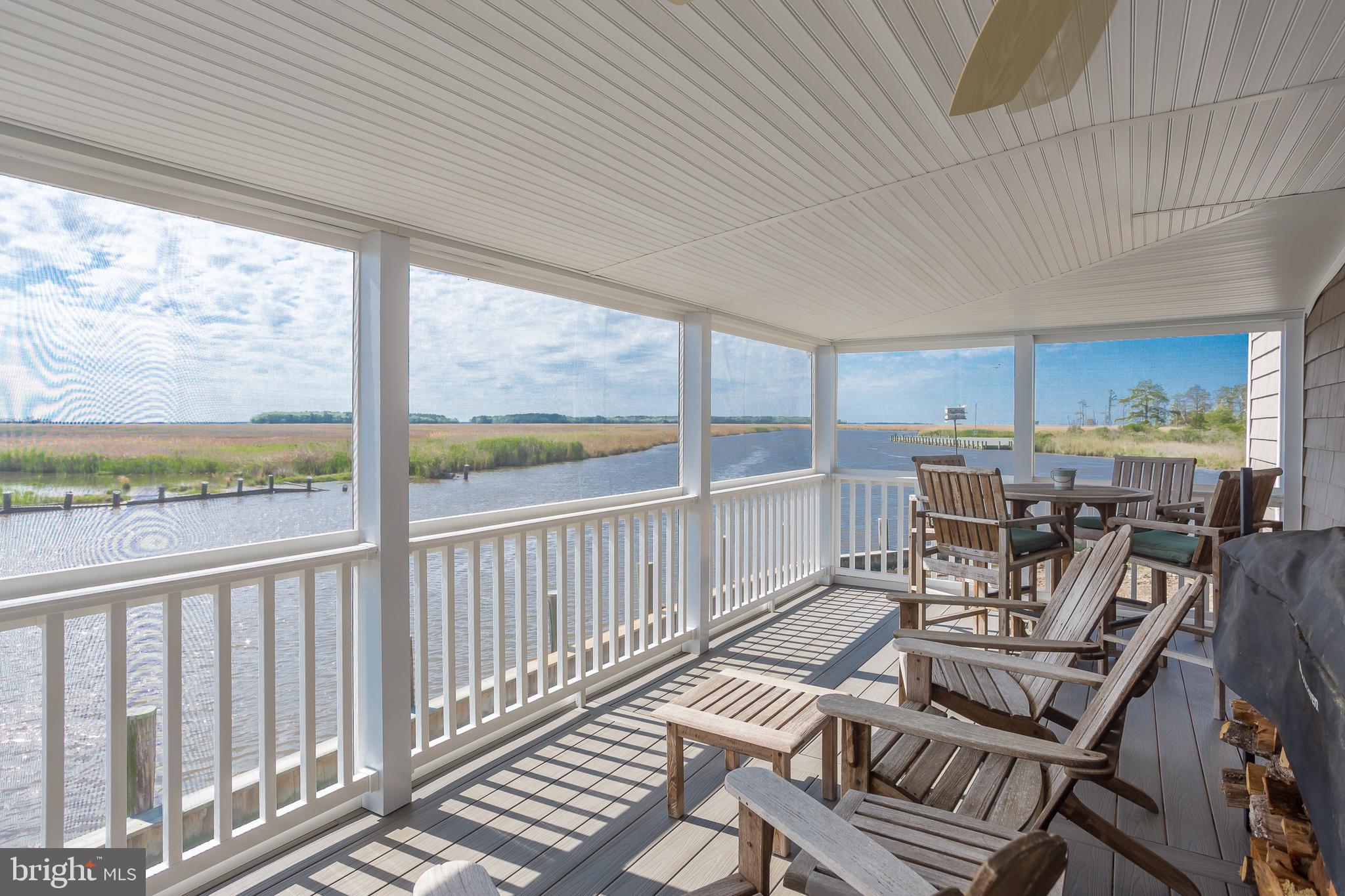 3706 Bestpitch Ferry Road Cambridge, MD 21613 - Photo 14 of 43 a view of a patio with wooden floor