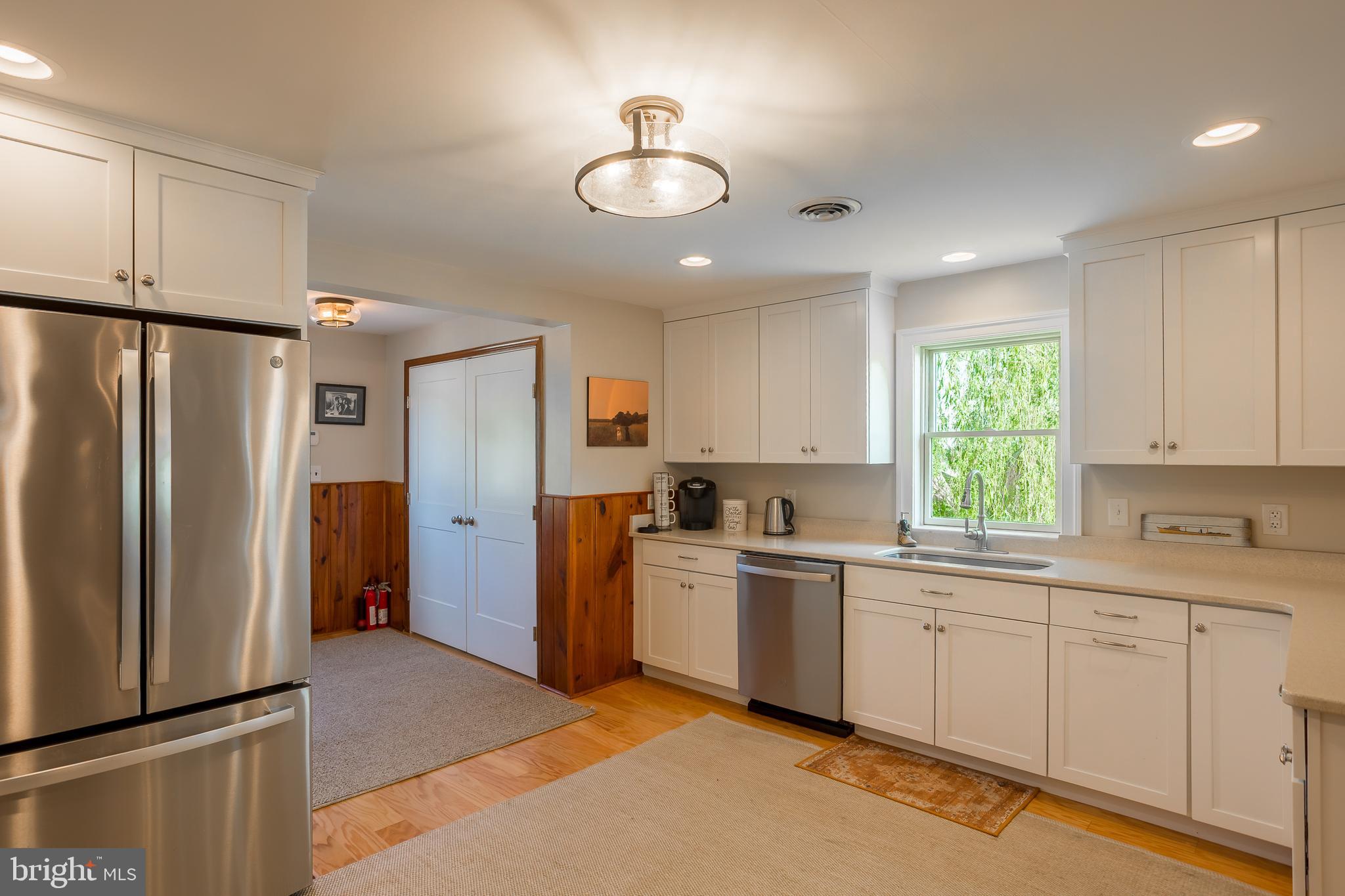 3706 Bestpitch Ferry Road Cambridge, MD 21613 - Photo 22 of 43 a kitchen with a sink stainless steel appliances cabinets and a window
