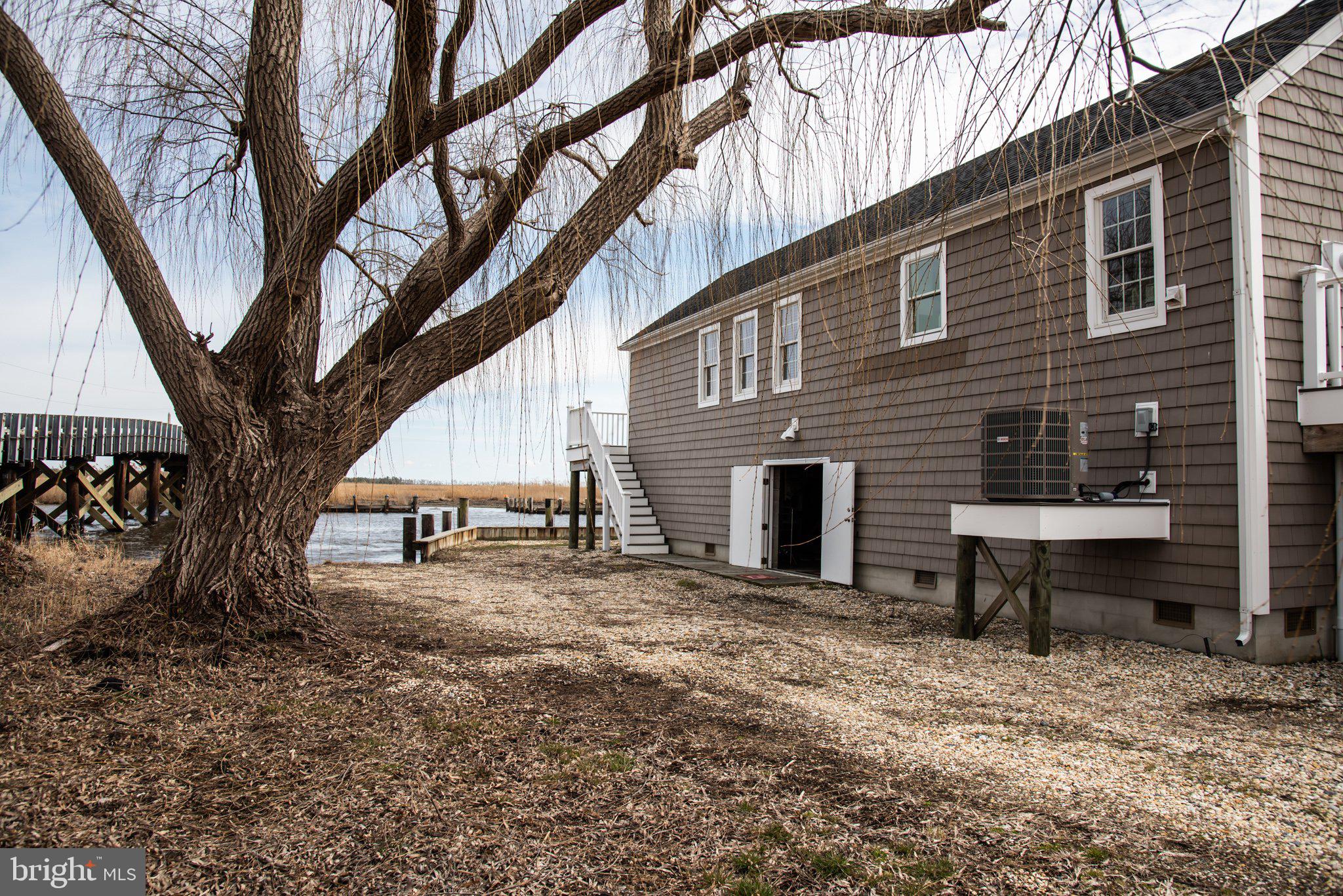 3706 Bestpitch Ferry Road Cambridge, MD 21613 - Photo 6 of 43 a view of house with backyard and seating area