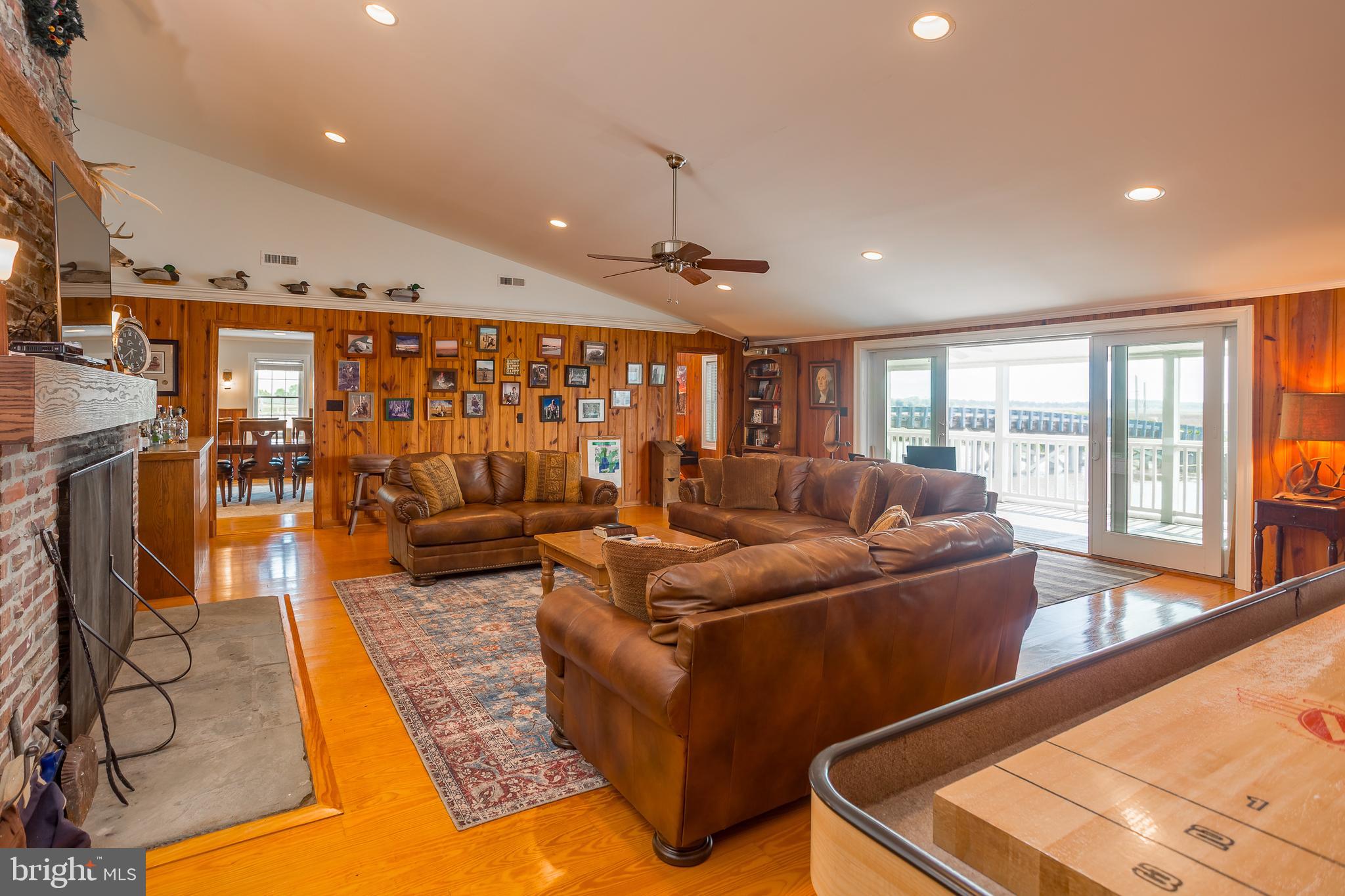 3706 Bestpitch Ferry Road Cambridge, MD 21613 - Photo 9 of 43 a living room with furniture and large window