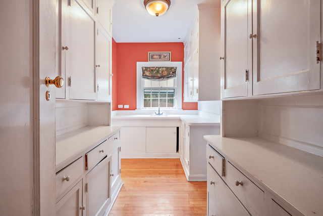 60 Sheridan Road Highland Park, IL 60035 - Photo 12 of 29 a kitchen that has a sink and a stove in it