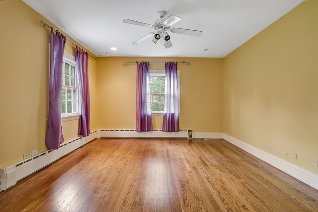 60 Sheridan Road Highland Park, IL 60035 - Photo 14 of 29 a view of an empty room with window and wooden floor