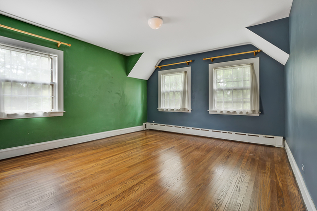 60 Sheridan Road Highland Park, IL 60035 - Photo 20 of 29 a view of an empty room with wooden floor and a window