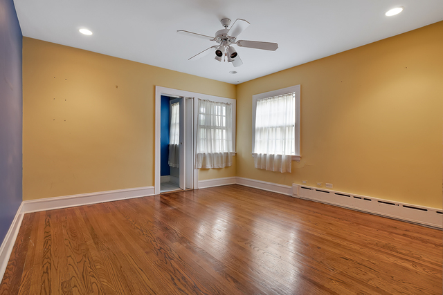 60 Sheridan Road Highland Park, IL 60035 - Photo 21 of 29 wooden floor in an empty room with a window