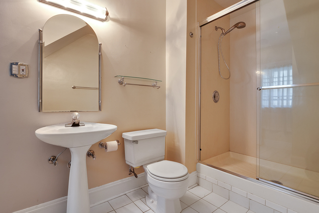 60 Sheridan Road Highland Park, IL 60035 - Photo 22 of 29 a bathroom with a sink toilet and shower