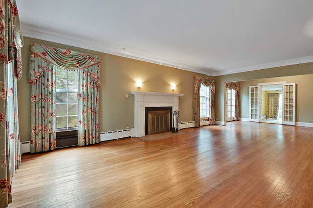 60 Sheridan Road Highland Park, IL 60035 - Photo 5 of 29 an empty room with wooden floor and windows