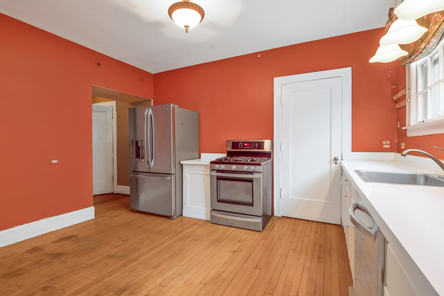 60 Sheridan Road Highland Park, IL 60035 - Photo 10 of 29 a kitchen with a refrigerator sink and stove