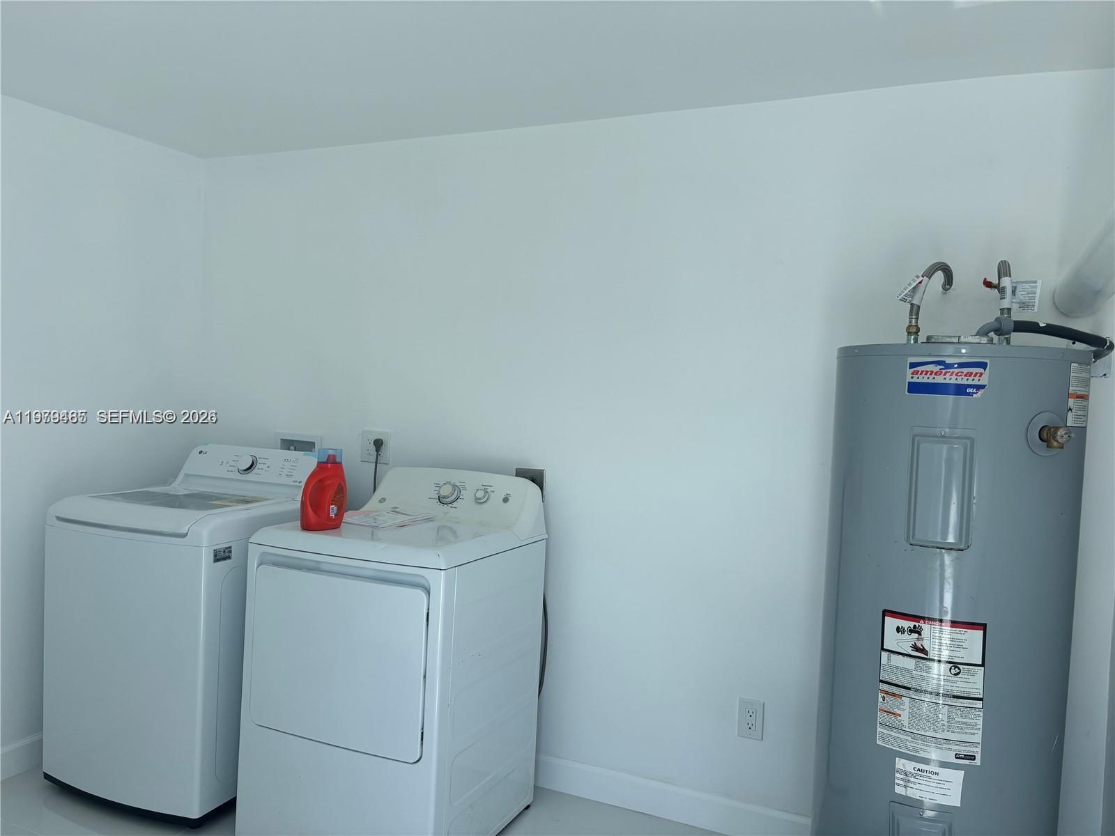 3340 Southwest 94th Place, Unit 1 Miami, FL 33165 - Photo 19 of 21 a utility room with dryer and washer