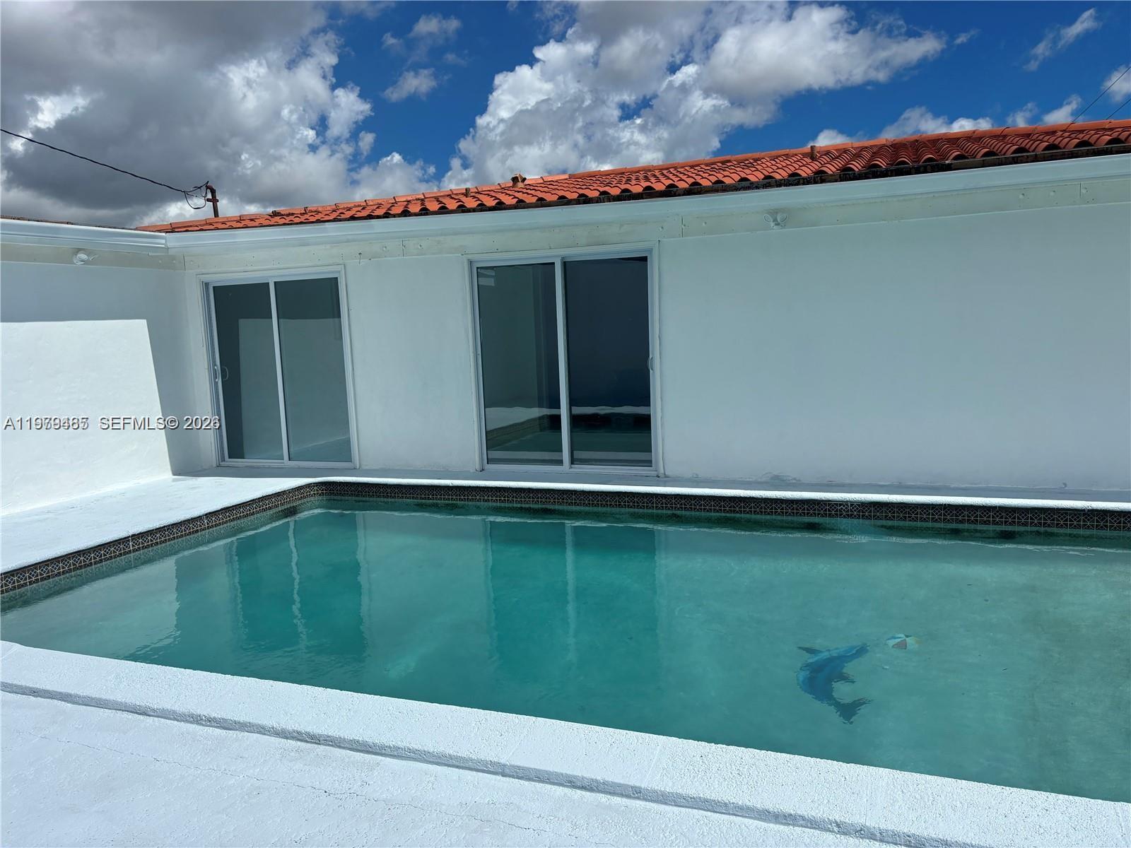 3340 Southwest 94th Place, Unit 1 Miami, FL 33165 - Photo 20 of 21 a view of outdoor space and a swimming pool