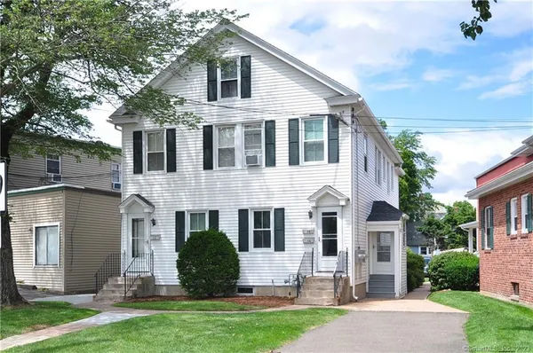 front view of a house with a yard