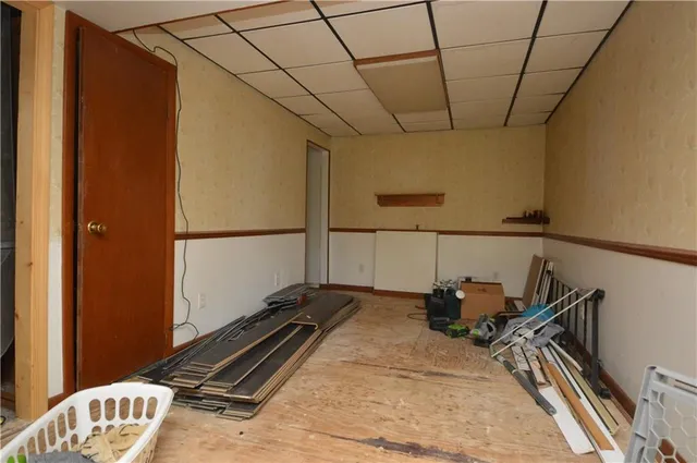 a bed room with a bed and a book shelf