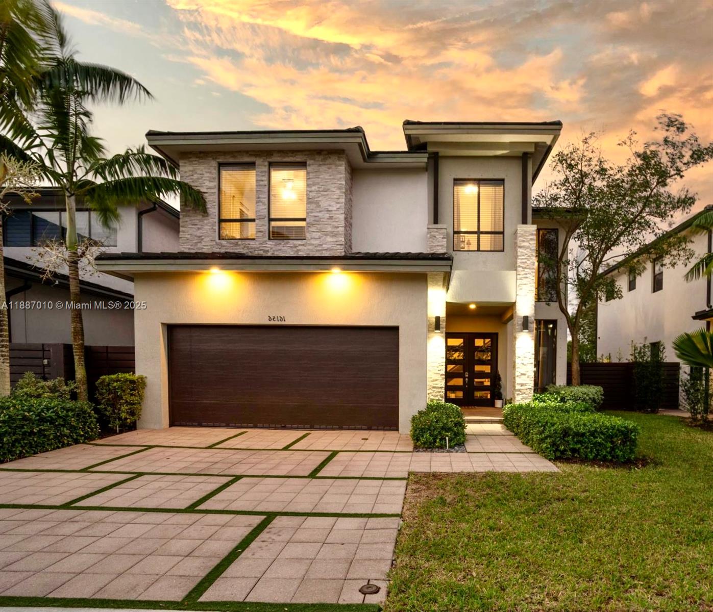 a front view of a house with a yard