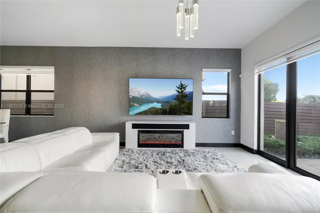 a bedroom with a bed a dresser and potted plants