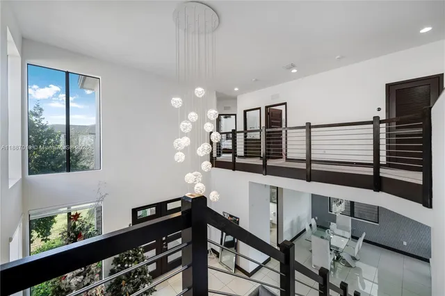 an aerial view of residential houses with outdoor space and street view