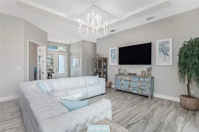 a kitchen with granite countertop a sink dishwasher stove and oven with wooden floor