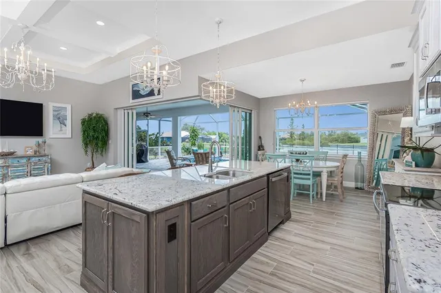 a bed room with a bed and a chandelier