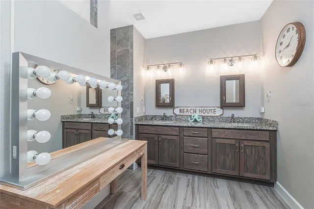 a bedroom with two beds and a chandelier