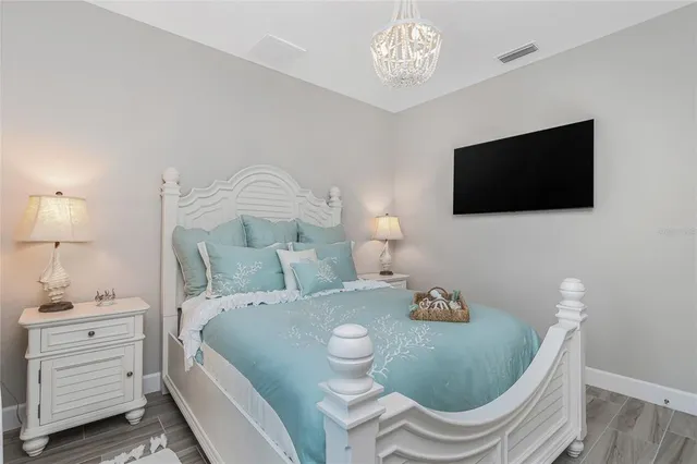a dining room with furniture and a potted plant