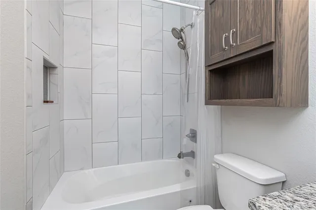 a view of a swimming pool with an outdoor space and seating