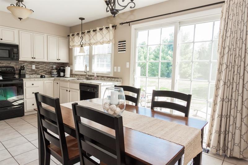 6 Castle View Drive McKees Rocks, PA 15136 - Photo 10 of 25 This oversized space can be treated as an eat-in kitchen or a formal dining space. Sliding glass doors bring in tons of natural light and lead out to the private patio.