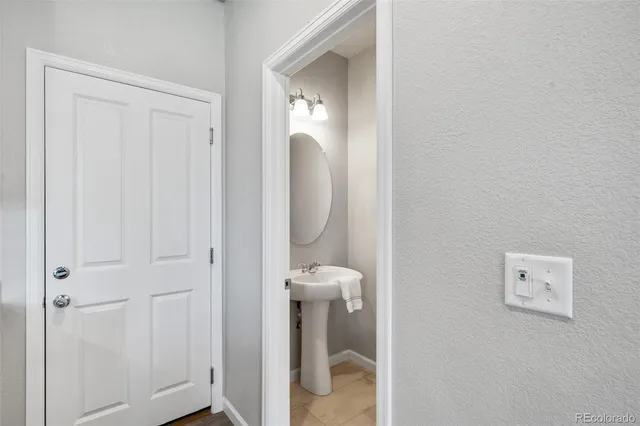 a view of a hallway with toilet