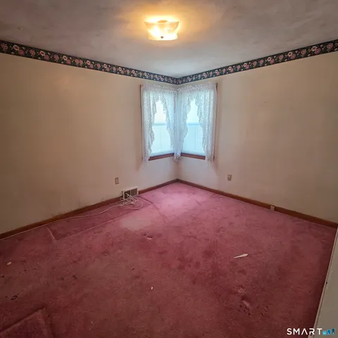 a bathroom with a sink a mirror and a shower