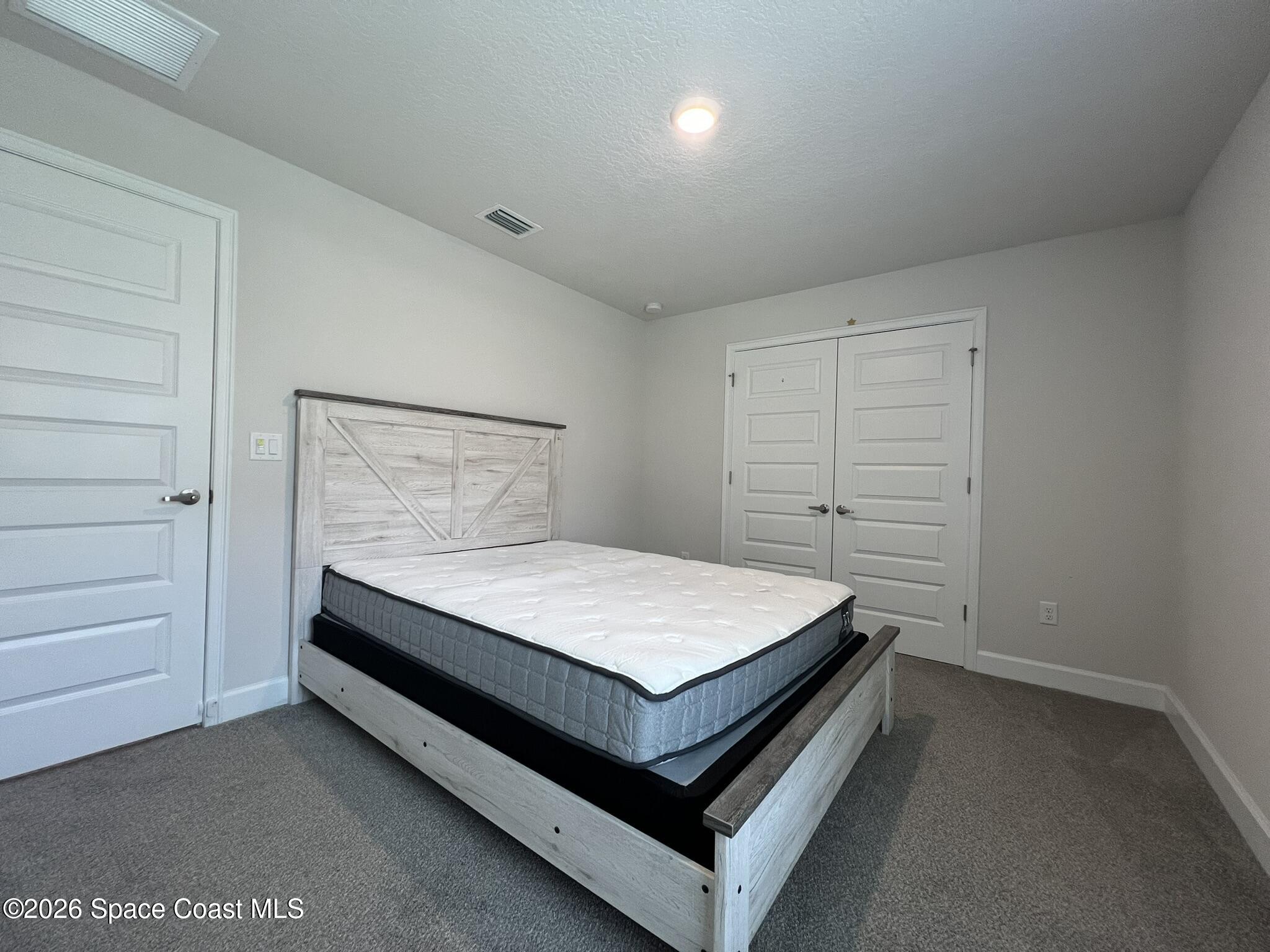 8752 Waterstone Boulevard Fort Pierce, FL 34951 - Photo 17 of 24 a bed sitting in a room
