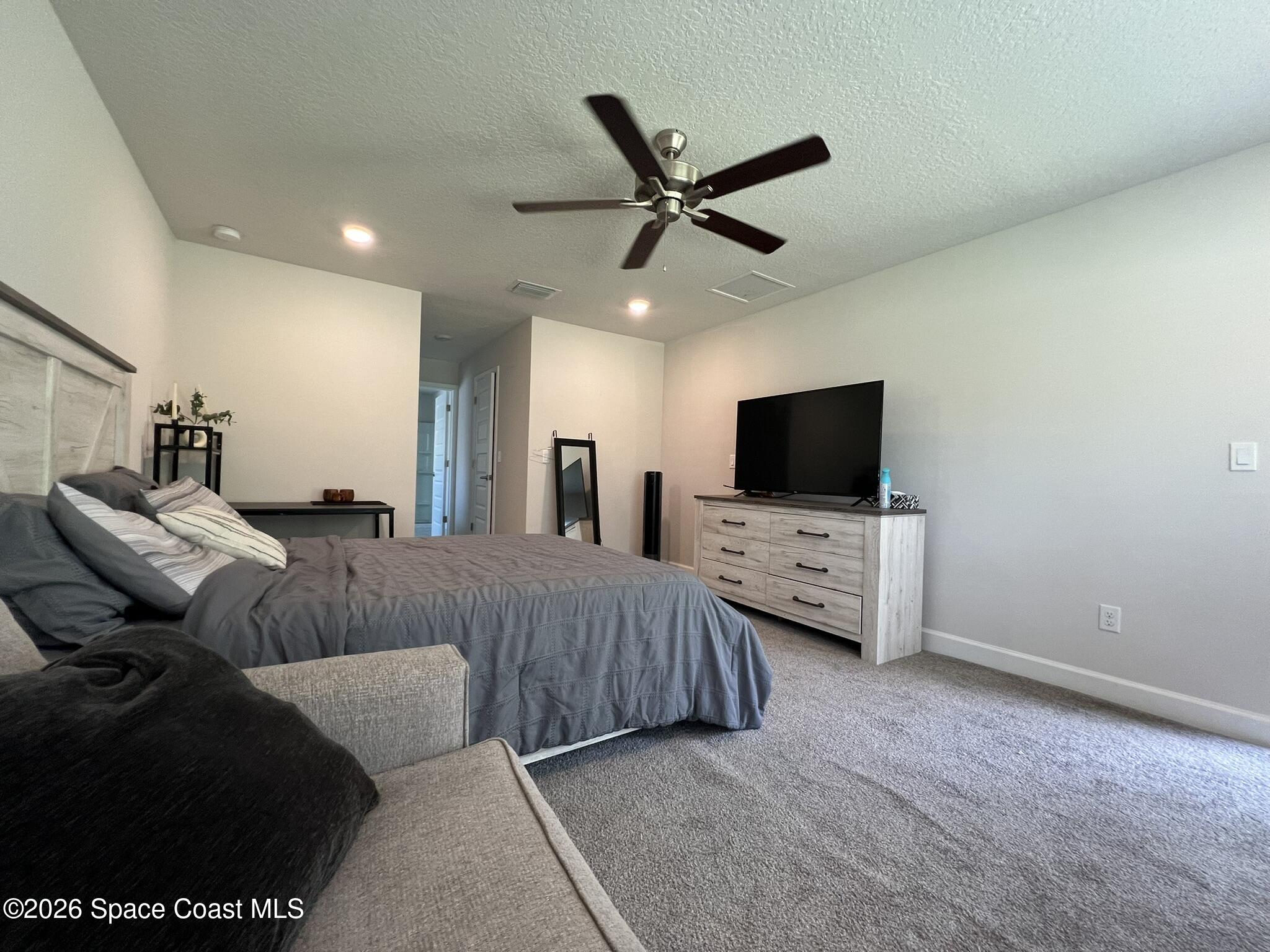 8752 Waterstone Boulevard Fort Pierce, FL 34951 - Photo 10 of 24 a living room with furniture and a flat screen tv