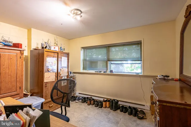 a room with gym equipment and a large window