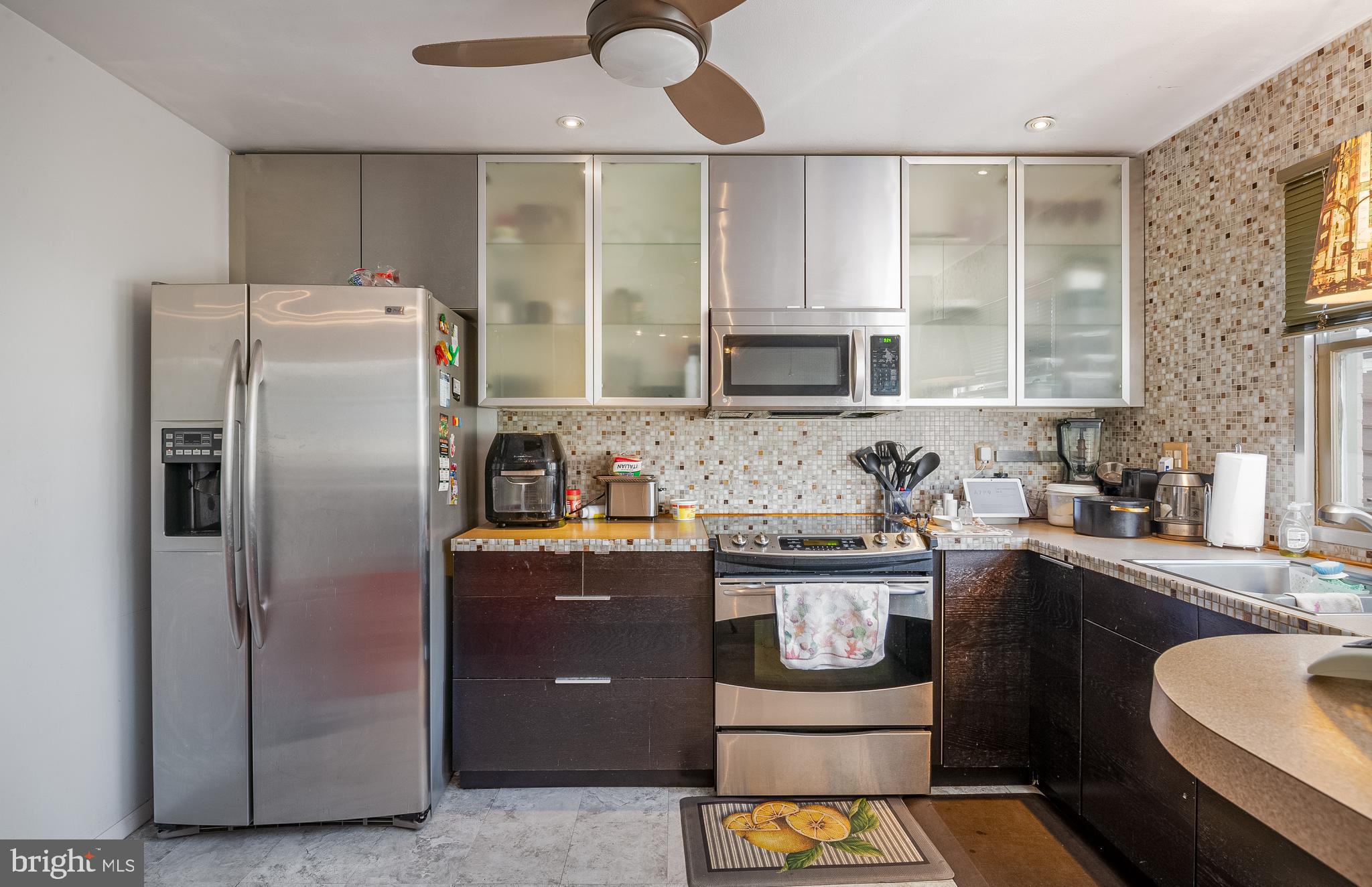 2550 Grant Street Reading, PA 19606 - Photo 9 of 18 a kitchen with stainless steel appliances granite countertop a refrigerator a stove a sink and a microwave