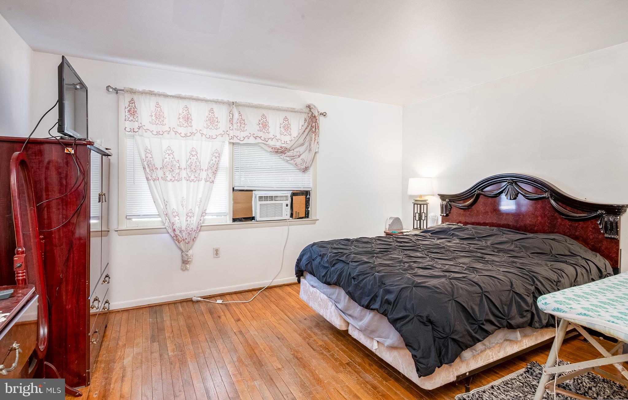 2550 Grant Street Reading, PA 19606 - Photo 10 of 18 a bedroom with a bed a window and mirror